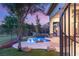 Beautiful outdoor pool area with mature trees and lush landscaping at 21 Avenida Sorrento, Henderson, NV 89011