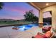 Inviting pool area with covered patio that overlooks the nearby golf course at 21 Avenida Sorrento, Henderson, NV 89011