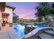 Resort style pool with rock waterfall and mountain views at sunset at 21 Avenida Sorrento, Henderson, NV 89011