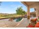 Inviting covered patio with comfortable seating, pool, and views of the surrounding golf course at 21 Avenida Sorrento, Henderson, NV 89011