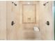 Luxurious shower features a built-in bench, neutral tile and dual shower heads at 21 Avenida Sorrento, Henderson, NV 89011