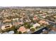 Aerial view of a sprawling residential neighborhood, showcasing diverse home styles and lush greenery at 2101 Diamond Bar Dr, Las Vegas, NV 89117