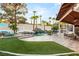 Backyard oasis with a waterfall pool, lush landscaping, and ample space for outdoor recreation and enjoyment at 2101 Diamond Bar Dr, Las Vegas, NV 89117