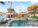Resort-style backyard with a waterfall pool, cozy seating, and meticulously landscaped grounds for ultimate relaxation at 2101 Diamond Bar Dr, Las Vegas, NV 89117