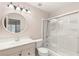 Clean bathroom with a sleek vanity, mirrored medicine cabinet, and a shower-tub combination for relaxation at 2101 Diamond Bar Dr, Las Vegas, NV 89117