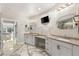 Bathroom with dual vanities, modern lighting, and access to the glass shower and sauna at 2101 Diamond Bar Dr, Las Vegas, NV 89117