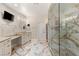 Elegant bathroom with marble floors, granite countertops, and a glass-enclosed shower at 2101 Diamond Bar Dr, Las Vegas, NV 89117