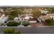 Stunning home exterior featuring manicured landscaping, a tile roof, and a circular driveway leading to the garage at 2101 Diamond Bar Dr, Las Vegas, NV 89117