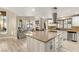 Kitchen island flows into a cozy living room featuring a fireplace and plush seating at 2101 Diamond Bar Dr, Las Vegas, NV 89117