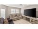 Cozy living room showcasing a comfortable sofa, large TV, and a decorative entertainment center at 2101 Diamond Bar Dr, Las Vegas, NV 89117