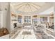 Inviting living room with vaulted ceilings, fireplace, large windows, and stylish furnishings at 2101 Diamond Bar Dr, Las Vegas, NV 89117