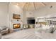 Open concept living area featuring a fireplace and seamless flow to the kitchen at 2101 Diamond Bar Dr, Las Vegas, NV 89117