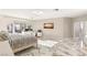 Bright main bedroom with marble floors, and modern decor with an office area at 2101 Diamond Bar Dr, Las Vegas, NV 89117