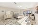 Spacious main bedroom featuring marble floors, a work space, and natural light at 2101 Diamond Bar Dr, Las Vegas, NV 89117
