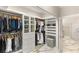 Luxurious walk-in closet with custom shelving, drawers, and hanging rods for optimal organization and storage at 2101 Diamond Bar Dr, Las Vegas, NV 89117