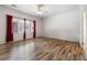 Bright bedroom featuring hardwood floors, natural light, and neutral paint at 2164 Sawtooth Mountain Dr, Henderson, NV 89044
