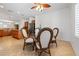 Bright breakfast nook with hardwood floors, natural light, and seating for four at 2164 Sawtooth Mountain Dr, Henderson, NV 89044