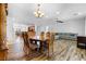 Formal dining room featuring a hardwood table and floors, decorative lighting and plenty of space at 2164 Sawtooth Mountain Dr, Henderson, NV 89044