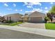 Charming single story home featuring a neatly landscaped front yard and paver driveway at 2164 Sawtooth Mountain Dr, Henderson, NV 89044