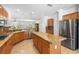 Gourmet kitchen featuring stainless steel appliances, granite counters, and an island at 2164 Sawtooth Mountain Dr, Henderson, NV 89044