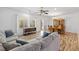 Spacious living room featuring hardwood floors, plenty of natural light, and comfortable seating at 2164 Sawtooth Mountain Dr, Henderson, NV 89044