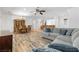 Open concept living and dining room with hardwood floors and comfortable seating at 2164 Sawtooth Mountain Dr, Henderson, NV 89044