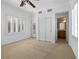 Spacious main bedroom with plantation shutters, neutral carpet, and attached bathroom at 2164 Sawtooth Mountain Dr, Henderson, NV 89044