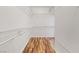 Walk-in closet with ample shelving space and wood-look flooring at 2164 Sawtooth Mountain Dr, Henderson, NV 89044