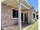 Backyard with a covered patio, low maintenance landscaping, and access to the home's exterior at 2312 Indigo Island St, Henderson, NV 89044