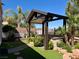 Well-maintained outdoor living space featuring a covered patio area and manicured landscaping at 2312 Indigo Island St, Henderson, NV 89044