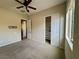 Neutral bedroom with a ceiling fan, carpet flooring, and a closet for ample storage at 2312 Indigo Island St, Henderson, NV 89044
