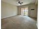 Expansive bedroom featuring a ceiling fan and sliding glass doors to a patio at 2312 Indigo Island St, Henderson, NV 89044