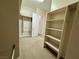 Well organized walk-in closet with built in shelves and rods at 2312 Indigo Island St, Henderson, NV 89044