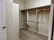 Walk-in closet with built-in shelving and hanging rods at 2312 Indigo Island St, Henderson, NV 89044