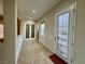 Welcoming entryway with decorative glass door and tiled floor at 2312 Indigo Island St, Henderson, NV 89044