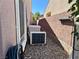 Side yard featuring HVAC system components, ensuring efficient climate control for enhanced comfort at 2312 Indigo Island St, Henderson, NV 89044