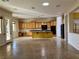 Spacious kitchen with large island, built in desk, and tile flooring at 2312 Indigo Island St, Henderson, NV 89044