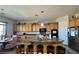 Spacious kitchen featuring a large island, wood cabinets, stainless steel appliances, and ample counter space at 2312 Indigo Island St, Henderson, NV 89044