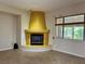 Cozy living room featuring a modern fireplace and a serene view of the outdoors at 2312 Indigo Island St, Henderson, NV 89044