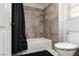 Cozy bathroom featuring a tiled shower-tub combo and modern fixtures at 2631 Bed Knoll Ct, North Las Vegas, NV 89031