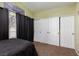 Inviting bedroom featuring a large window, closet, and comfortable bed at 2631 Bed Knoll Ct, North Las Vegas, NV 89031