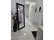 Hallway featuring a large decorative mirror and art leading to other rooms in the home at 2631 Bed Knoll Ct, North Las Vegas, NV 89031