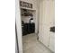 Functional laundry room features a washer, dryer, storage shelves, and ample cabinet space at 2631 Bed Knoll Ct, North Las Vegas, NV 89031
