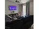 Inviting living room with a fireplace, modern television, and an abundance of comfortable seating at 2631 Bed Knoll Ct, North Las Vegas, NV 89031
