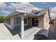 Enclosed patio area featuring a covered structure, sliding glass doors, and neutral color palette, perfect for outdoor enjoyment at 2631 Bed Knoll Ct, North Las Vegas, NV 89031