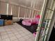 Covered patio area with a play area and storage, as seen through the living room's doors at 2631 Bed Knoll Ct, North Las Vegas, NV 89031