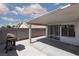 Outdoor patio area with concrete flooring, covered structure, and sliding glass door, great for relaxing and entertaining at 2631 Bed Knoll Ct, North Las Vegas, NV 89031