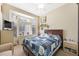 Comfortable bedroom featuring a bay window and a large bed with hardwood floors at 2725 Byron Dr, Las Vegas, NV 89134