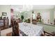 Open dining room with chandelier is adjacent to the living room and kitchen at 2725 Byron Dr, Las Vegas, NV 89134