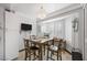 Cozy dining room featuring a chandelier, bay window, and a built-in cabinet at 2725 Byron Dr, Las Vegas, NV 89134